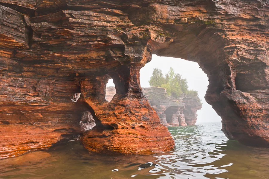 A Devils Island arch as seen from the water, with its many layers of sandstone.