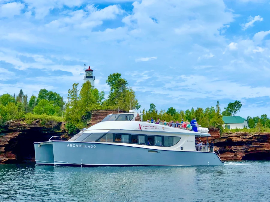 Apostle Islands Cruises boat, the Archipelago, passes close by Devils Island.