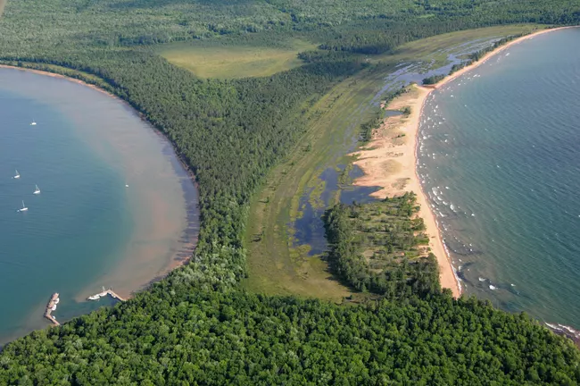 The sandy tombolo on Stockton Island, with Lake Superior water on either side.