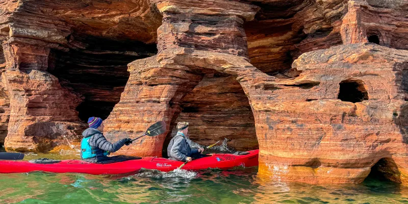 An Apostle Islands Kayaking Express tour paddling through Devils Island Sea Caves