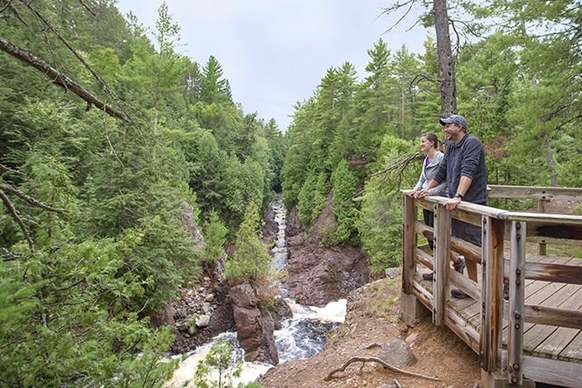 Julian Bay hiking trail on Stockton Island, which features a sandy Lake Superior beach enclosed by forest.